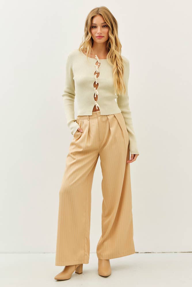 BOLD STATEMENT METALLIC SWEATER KNIT TOP WITH BOWS