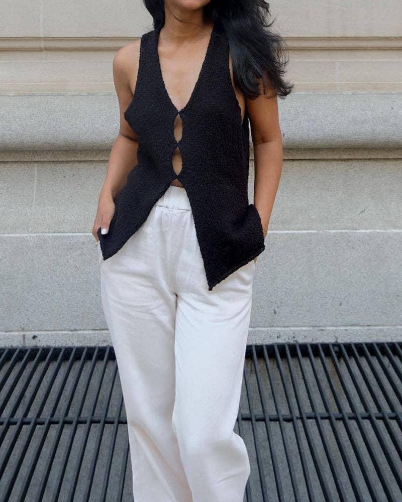 Classic Ladies Solid Color V Neck Knit Vest featuring a timeless design, perfect for layering over shirts and dresses