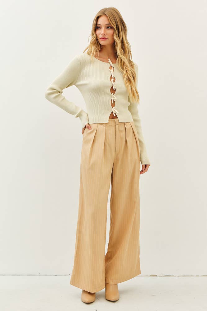 BOLD STATEMENT METALLIC SWEATER KNIT TOP WITH BOWS