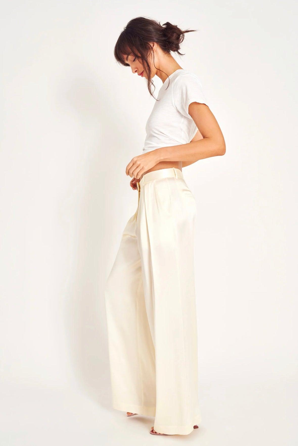 Elegant Love Shack Fancy Emberlynn Pant in Ivory featuring a flowing design and delicate details, perfect for dressing up any outfit.